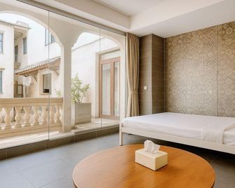 Haikou Old Arcade Street Serenity Guesthouse - האיקואו - חדר שינה