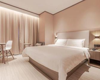 Hanting Hotel Changchun Hongqi Street Wanda - ฉางชุน - ห้องนอน