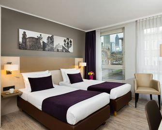 Leonardo Hotel Frankfurt City Center - פרנקפורט אם מיין - חדר שינה