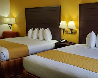 Best Western Executive Inn & Suites - Madisonville - Bedroom