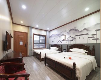 Kaifeng Moshe Courtyard Hotel (Qingming Riverside Park Branch) - Kai Feng - Camera da letto