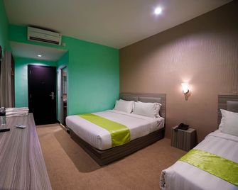 Greenland Hotel Batam - Batam - Schlafzimmer