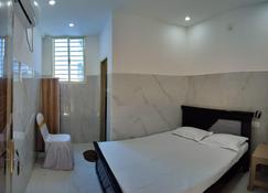 Vishnu Guest Inn - نيلور - غرفة نوم