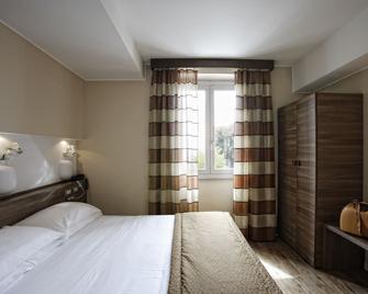 Hotel Porta Nuova - אסיסי - חדר שינה