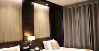 Dumaguete Royal Suite Inn - Dumaguete City - Schlafzimmer