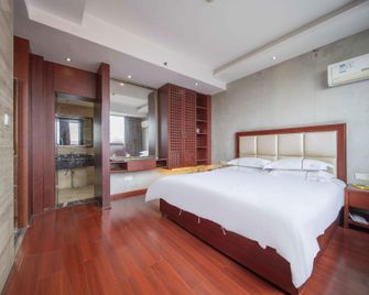 Huajian Hotel - Ji’an - Schlafzimmer