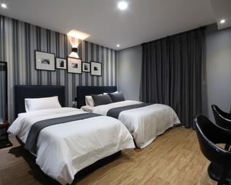 Changwon Jinhae Yongwon Nature Hotel Busan New Port Branch - Changwon - Bedroom