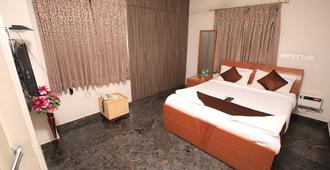 R-hotels Rithikha Inn porur - Madras - Slaapkamer