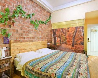Zhangjiajie Wutong Hostel - Zhangjiajie - Schlafzimmer