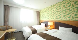Hotel Wing International Tomakomai - Tomakomai - Schlafzimmer
