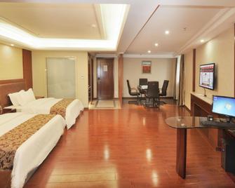 Xinghu Yipin Resort Hotel (Zhaoqing Railway Station) - Zhaoqing - Bedroom