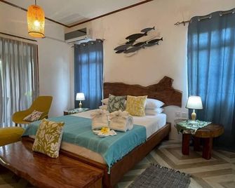 Milles Montagnes Residence - فيكتوريا - غرفة نوم