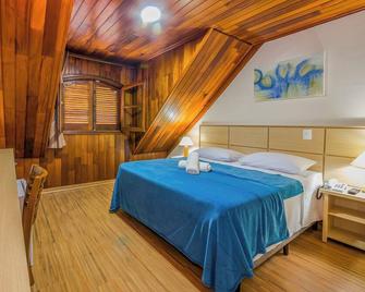 Hotel Euro Suíte Campos do Jordão By Nacional Inn - A 800 metros da Vila Capivari - Campos do Jordão - Soveværelse