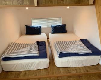 Amami Hoshizora Village Yadorihama - Setouchi - Schlafzimmer