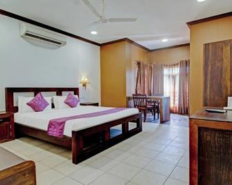 Treebo Premium Travancore Palace Cherthala - Alappuzha - Schlafzimmer