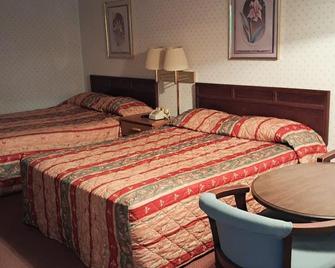 Holiday Capri Motel - Booneville - Bedroom