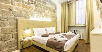 Hotel Ilaria - Lucca - Schlafzimmer