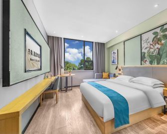 Qiqi L Hotel (Zhangzhou Yucheng Weiwu Avenue) - Bozhou - Спальня