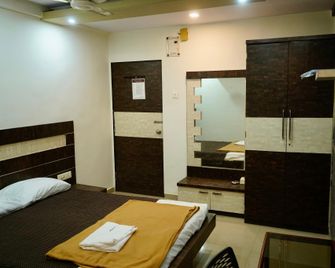 Hotel New Amber Loadging & Boarding - Boisar - Bedroom