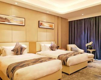 Ramada Plaza by Wyndham Dongxing City Center - Fangchenggang - Bedroom