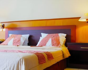 Hotel Mitra Inn - Kediri - Schlafzimmer