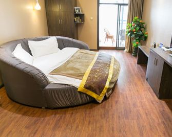 Xiyake Apartment Hostel (kunming Beitai Huayuan) - Kunming - Bedroom