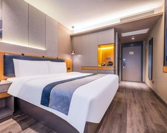 Home Inn Style Tianjin Hedong Wanda Plaza Sunshine Sunday - تيانجين - غرفة نوم