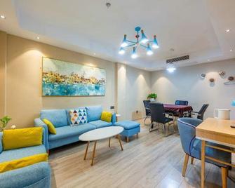Xingyuan Youjia Hotel - Jingmen - Wohnzimmer