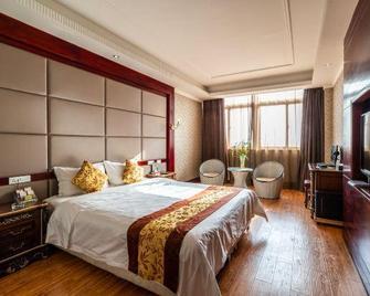 Huixian Home World Hotel - Xinxiang - Slaapkamer