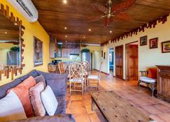 Warm Interiors and Orange Hues on Ground Floor in Front of Beach - Playa Flamingo - Living room