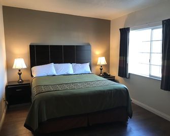 Manhattan Inn & Suites - מנהטן ביץ' - חדר שינה