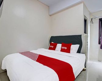 Hotel O Griya Putih - Yogyakarta - Schlafzimmer