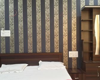 Hotel holiday Era Lodging - Aurangabad - Schlafzimmer