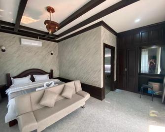 Xaymone Riverside Resort and Restaurant - Vang Vieng - Schlafzimmer
