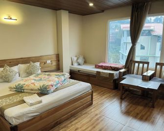 9 Senses Group Of Hotels Ravangla - Ravangla - Bedroom