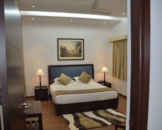 Welcomheritage Tarangi Ramganga Resort - Rāmnagar - Bedroom