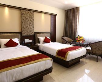 Green Embassy Hotel - Sagara - Bedroom