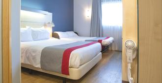 Holiday Inn Express Valencia - Bonaire - Valencia - Schlafzimmer