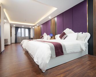 Me Q Beach Hotel & Apartment - Дананг - Спальня