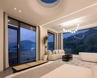 Floral Hotel Wuyuan Xiruo Sheye Homestay - Shangrao - Bedroom