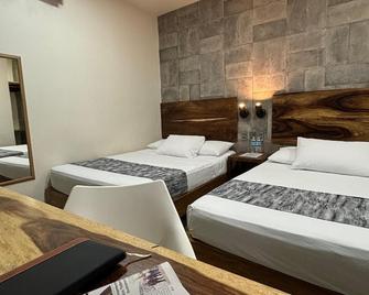 هوتل 15 أفينيدا - تاباتشولا - غرفة نوم