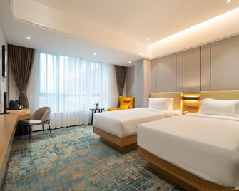 Rezen Longuu Hotel Zhanjiang Middle Shenchuan Avenue Dingsheng Plaza - Zhanjiang - Habitación