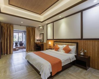 Linyu Huaxi Hot Spring Holiday Hotel - Zhangzhou - Bedroom