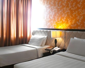 Manhattan Suites Inn - Dumaguete - Camera da letto