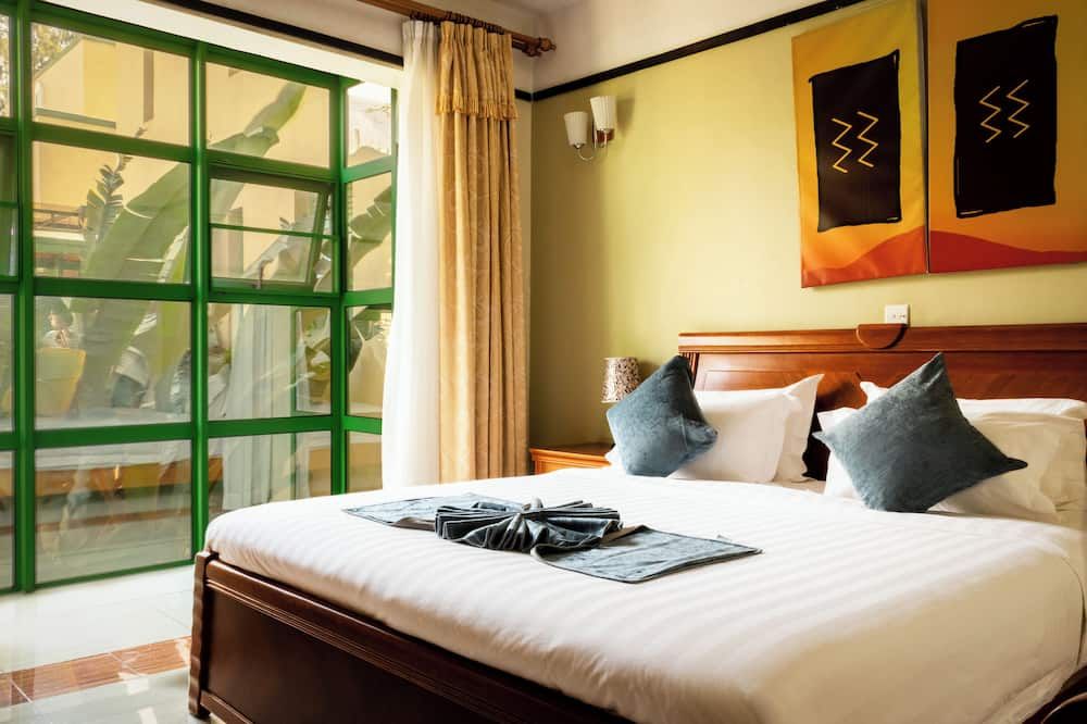 هايلاندز سويتس هوتل - كيغالي - غرفة نوم