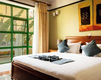 Highlands Suites Hotel and Apartments - Кігалі - Спальня