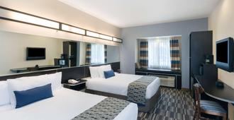 Microtel Inn & Suites by Wyndham Baton Rouge Airport - באטון רוז' - חדר שינה