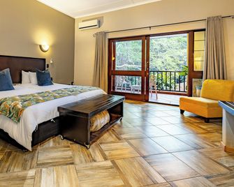Hotel Numbi and Garden Suites - Hazyview - Schlafzimmer
