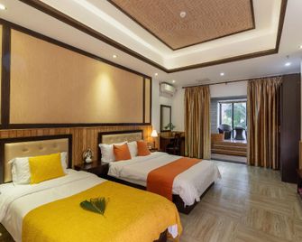 Linyu Huaxi Hot Spring Holiday Hotel - Zhangzhou - Schlafzimmer