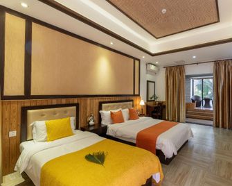 Linyu Huaxi Hot Spring Holiday Hotel - Zhangzhou - Schlafzimmer